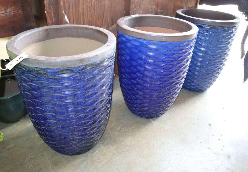 A set of three blue glazed circular garden planters, 42cm diameter, H.54cm